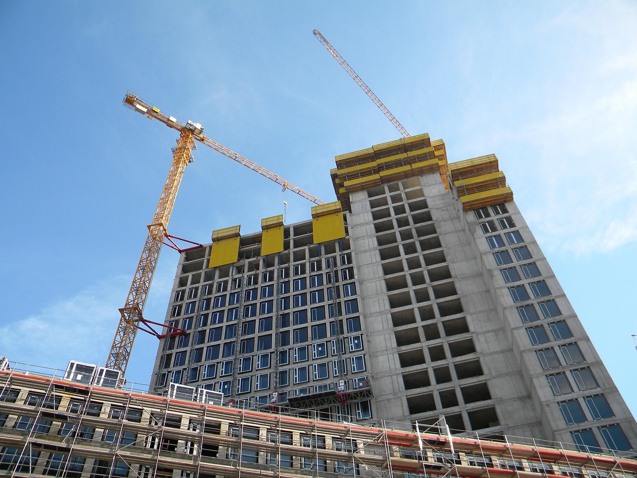 Tower cranes operating at high-rise construction site managed by Nyara Consults